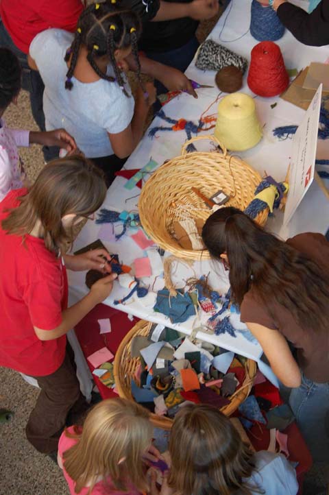 Children make cloth dolls in an activity presented by the American Textile History Museum.