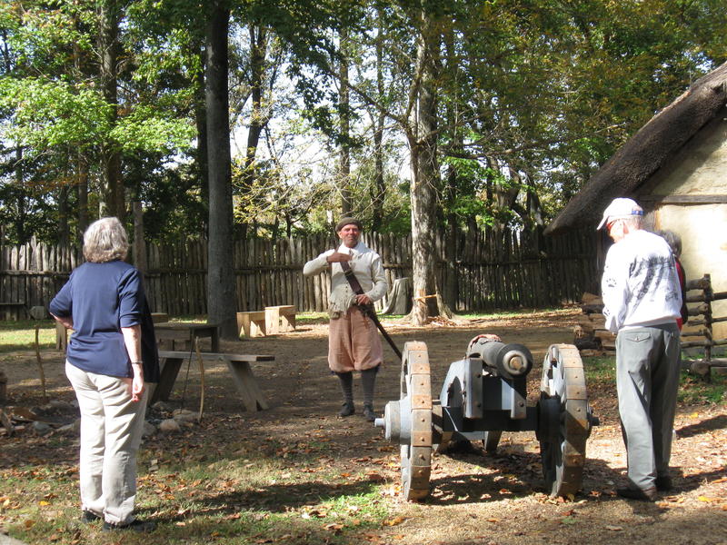 A historical reenactor demonstrates for visitors