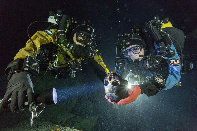 Divers at Hoyo Negro transport a 12,000-year-old skull for 3D scanning. (Photo: Paul Nicklen/National Geographic)