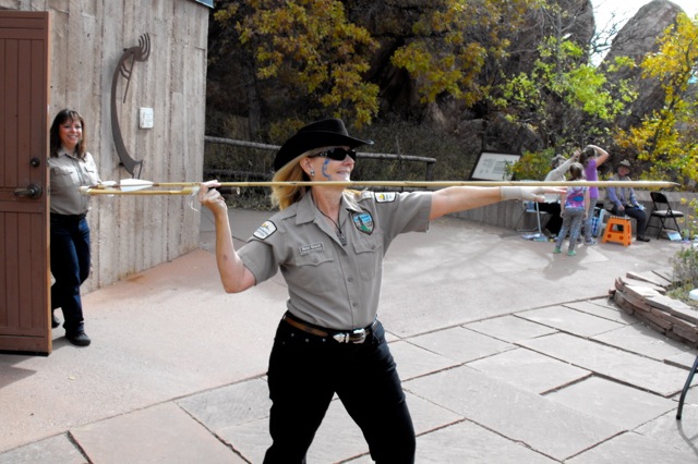 Betsy Healey demonstrates her atlatl technique at Roxborough State Park's 2012 event.