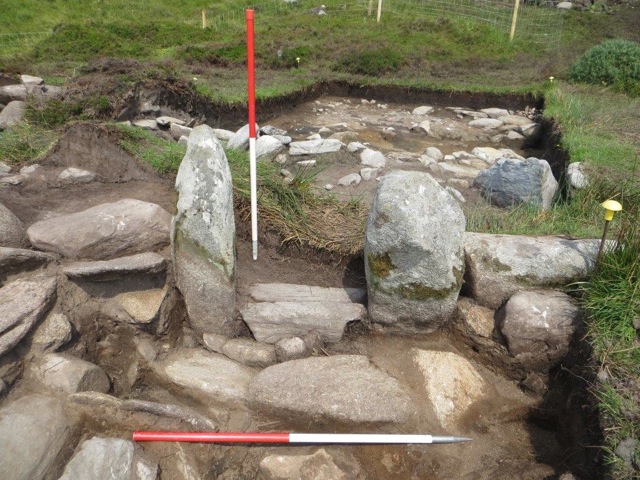 Uprights and sill stones leading into the large enclosure containing the pit cluster at the Cromlech Tumulus