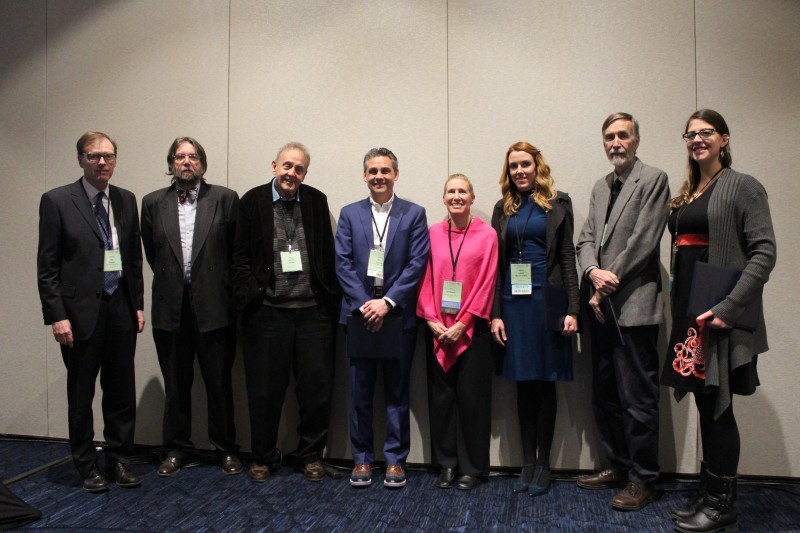 AIA award winners (from left), Ian Hodder, A. Mark Pollard, James Packer, Eric Poehler, AIA President Jodi Magness, Chelsea Gardner, Robert Kelly, and Laure Marest-Caffey