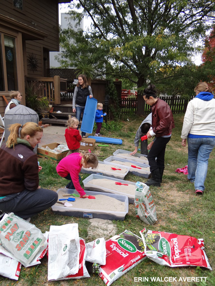 Dr. Averett, president of Lincoln-Omaha Society, and archaeology students from Creighton University prepare excavation kits for the Russell Child Development Center Preschool Archaeology workshop.