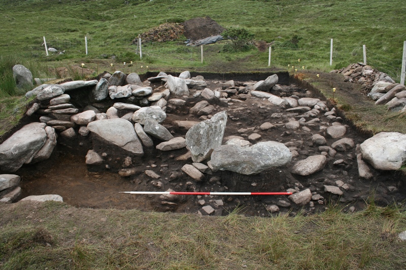 Looking northwards across the site at the extensive spread of soil and stone that was concealed by the rubble layer