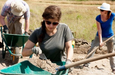 Sifting a shovelful of dirt. (Photo Courtesy of Rebecca Deitsch)