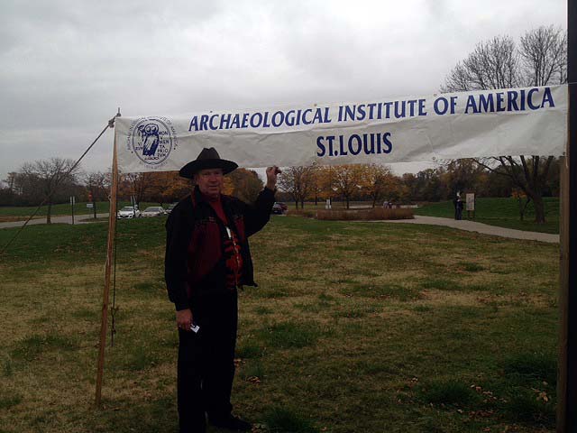 Professor Michael Fuller with the AIA sign at the entrance to the  museum.