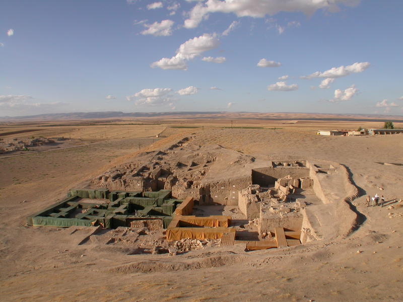 The Royal Palace of Urkesh, built around 2250 B.C. by king Tupkish. The walls, in mudbrick with a stone substructure, are covered by localized shelters that protect them from sun, wind, rain and even snow. The walls are thus preserved as documents in their integrity as first excavated, but at the same time they render the sense of the architectural volumes for which they were intended.