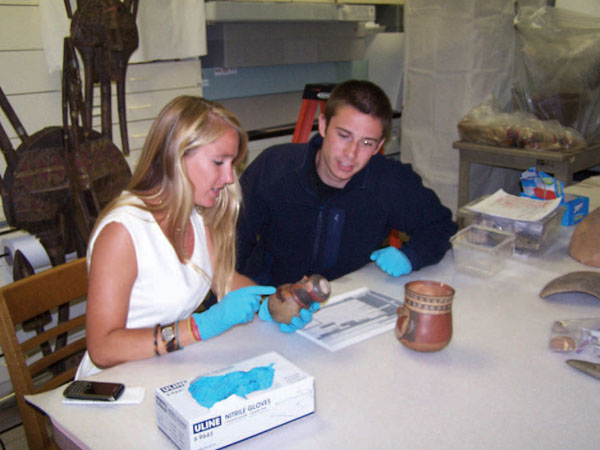 After searching the Online Artifact Database, students from “Conversation,” a Spanish class at Wake Forest University, work with objects and paper copies of database records in the Museum of Anthropology’s curation room. (Museum of Anthropology)