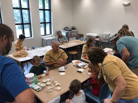 Volunteers help participants with archaeology themed-crafts. Photo courtesy of Charlotte County History Services.