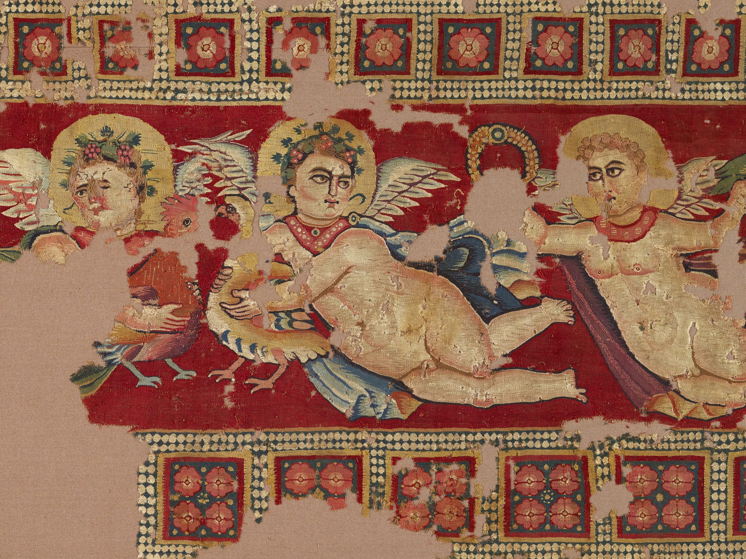 Hanging with erotes, animals, heads, and garlands (detail), eastern Mediterranean, 4th–5th century. 135 x 77 in. The Textile Museum 71.118. Acquired by George Hewitt Myers in 1950.